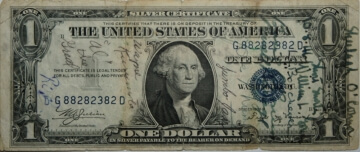 old one dollar bill with writing on it