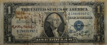 old one dollar bill with writing on it