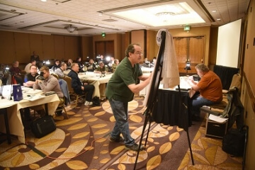 room filled with people sitting at tables