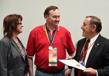 man with medal and others