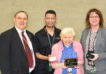 woman holding plaque