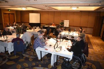 room full of people sitting at tables