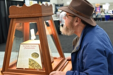 man looking at an a.n.a. display