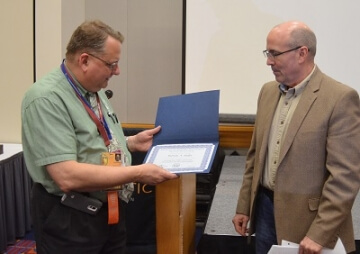 man with certificate