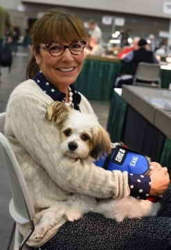 woman sitting with service dog