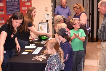 young numismatists at an a.n.a. table