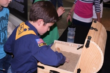 kids digging through treasure chest