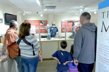 young numismatists watching a demonstration at the money museum