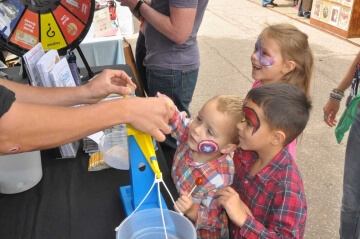 kids at outdoor a.n.a. table