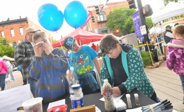 people at a table with balloons