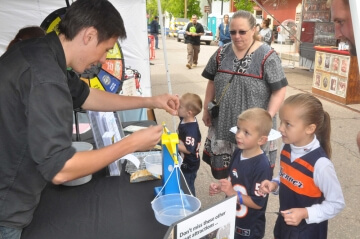 kids at outdoor a.n.a. table