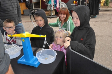 kids at outdoor a.n.a. table