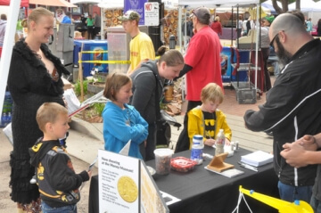 kids at outdoor a.n.a. table