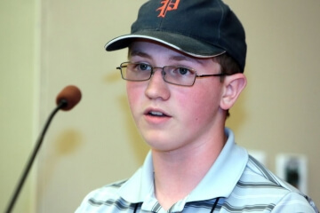 boy talking into microphone