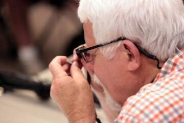 man examining coin