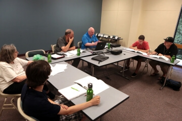 four people sitting at tables