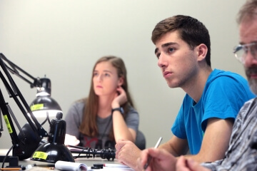 two people sitting at tables