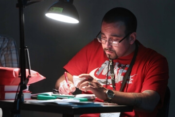 man looking at graded coin