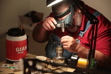 man examining coins