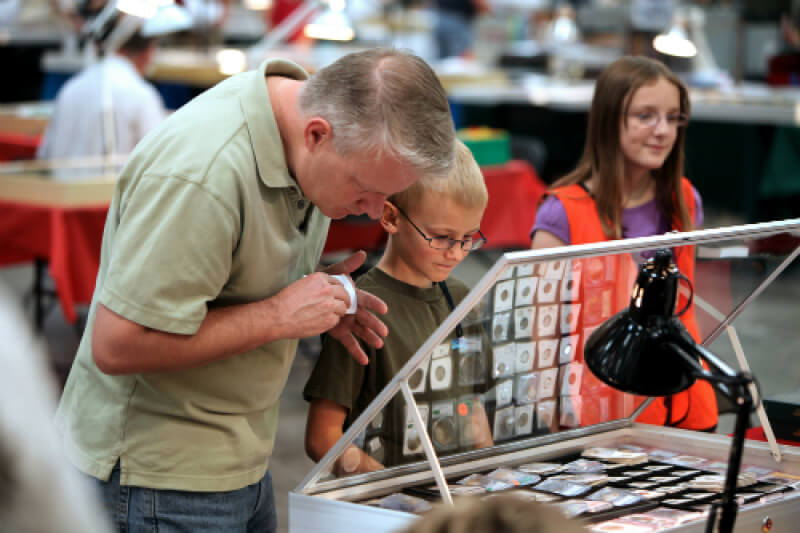 Father and son at coin show