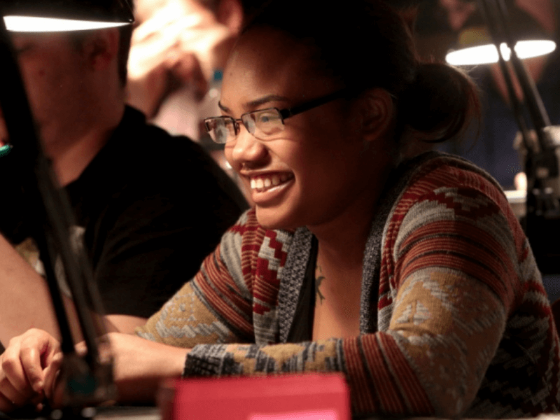 young lady studying coins