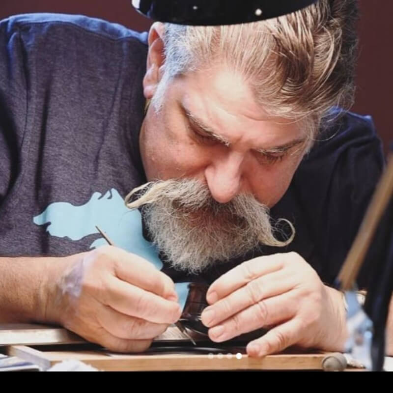 man studying coin