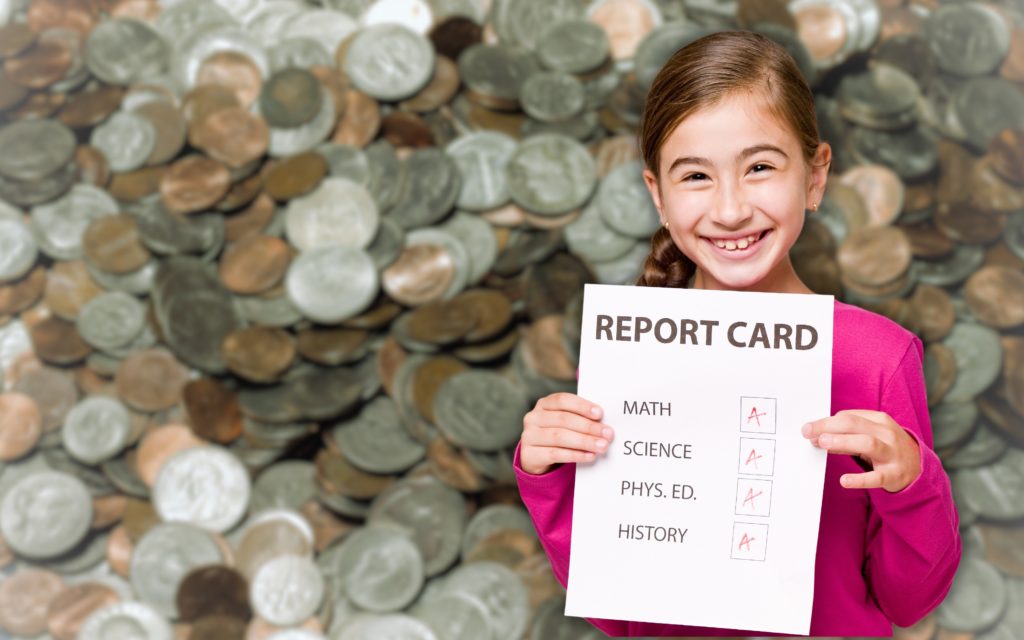 Young Girl with Report Card with Mixed US Coins Background