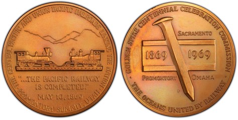 bronze medal with mountain background and train